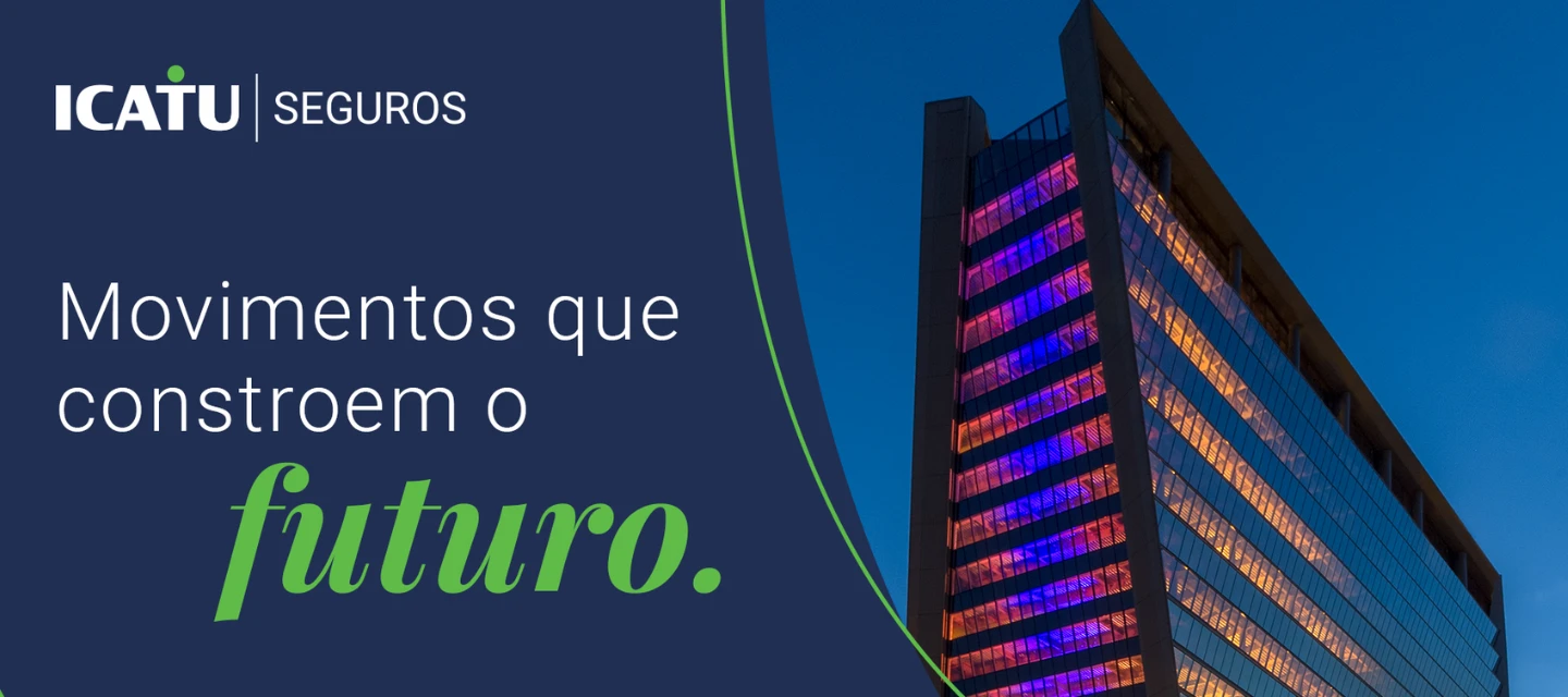 Imagem de um prédio moderno com iluminação colorida na cidade à noite, representando inovação e o futuro da construção civil.